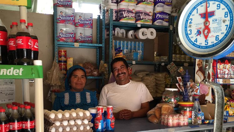 Hilaria Sanchez Hernandez and Eleuterio Hernandez Hernandez in their store in San Bartolome Quialana. (Cindy Carcamo / Los Angeles Times)