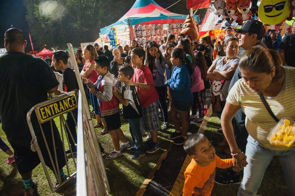 A Labor day weekend fair in Santa Ana. The city is 78 percent Latino. Credit, Andrew Cullen for The New York Times 